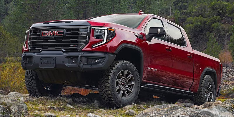 Red 2025 GMC Sierra 1500 parked on rocks