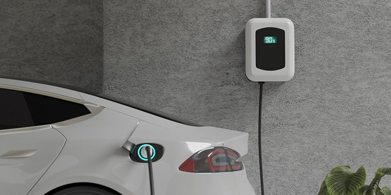 James Wood Buick GMC in Decatur TX close up of an electric car charging at home