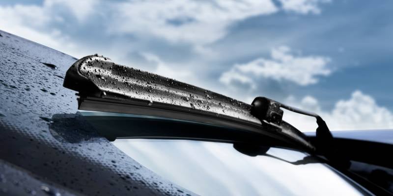 James Wood Buick GMC in Decatur TX close up of windshield wipers with raindrops on them